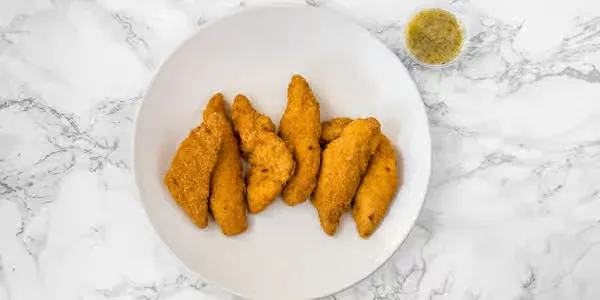 Crispy chicken fingers with dipping sauce at Yallah Eat on Pembina Hwy, Winnipeg