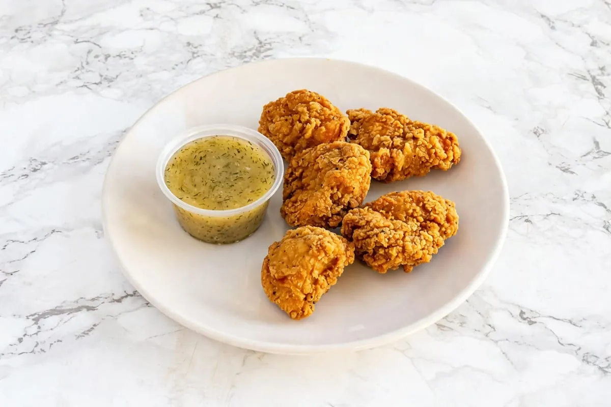 Chicken nuggets with dipping sauce at Yallah Eat on Pembina Hwy, Winnipeg