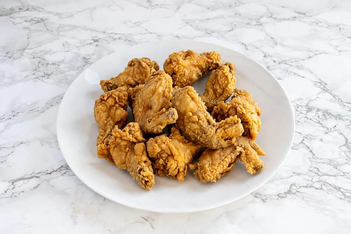 Twelve crispy chicken wings at Yallah Eat on Pembina Hwy, Winnipeg