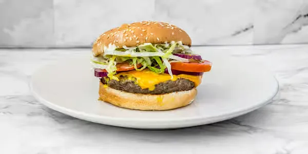 Classic beef burger with lettuce and tomato at Yallah Eat on Pembina Hwy, Winnipeg