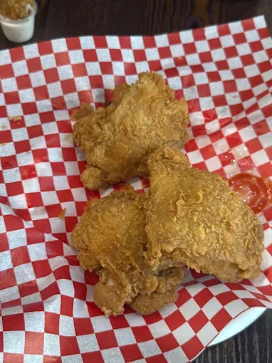 Fried chicken in a red-check basket at Yallah Eat on Pembina Hwy, Winnipeg