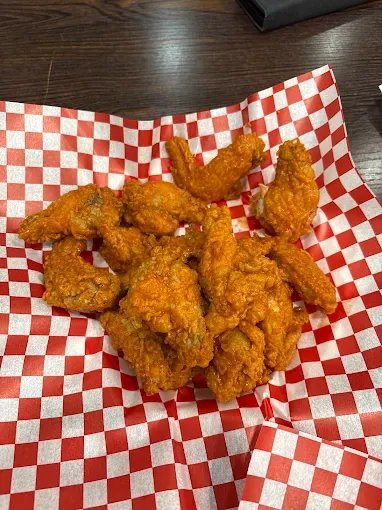 Hot wings in a red-check basket at Yallah Eat on Pembina Hwy, Winnipeg