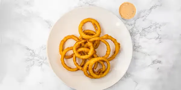 Crispy onion rings with dipping sauce at Yallah Eat on Pembina Hwy, Winnipeg
