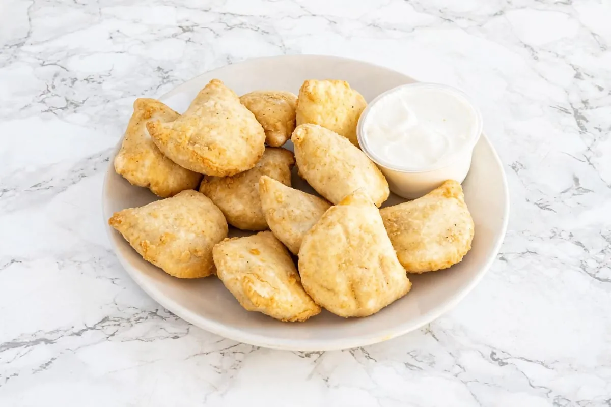 Fried potato perogies with sour cream at Yallah Eat on Pembina Hwy, Winnipeg